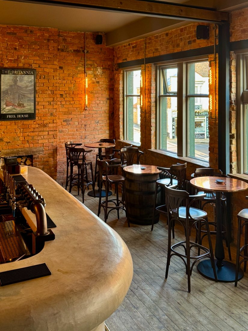 Afternoon light across the bar and window tables